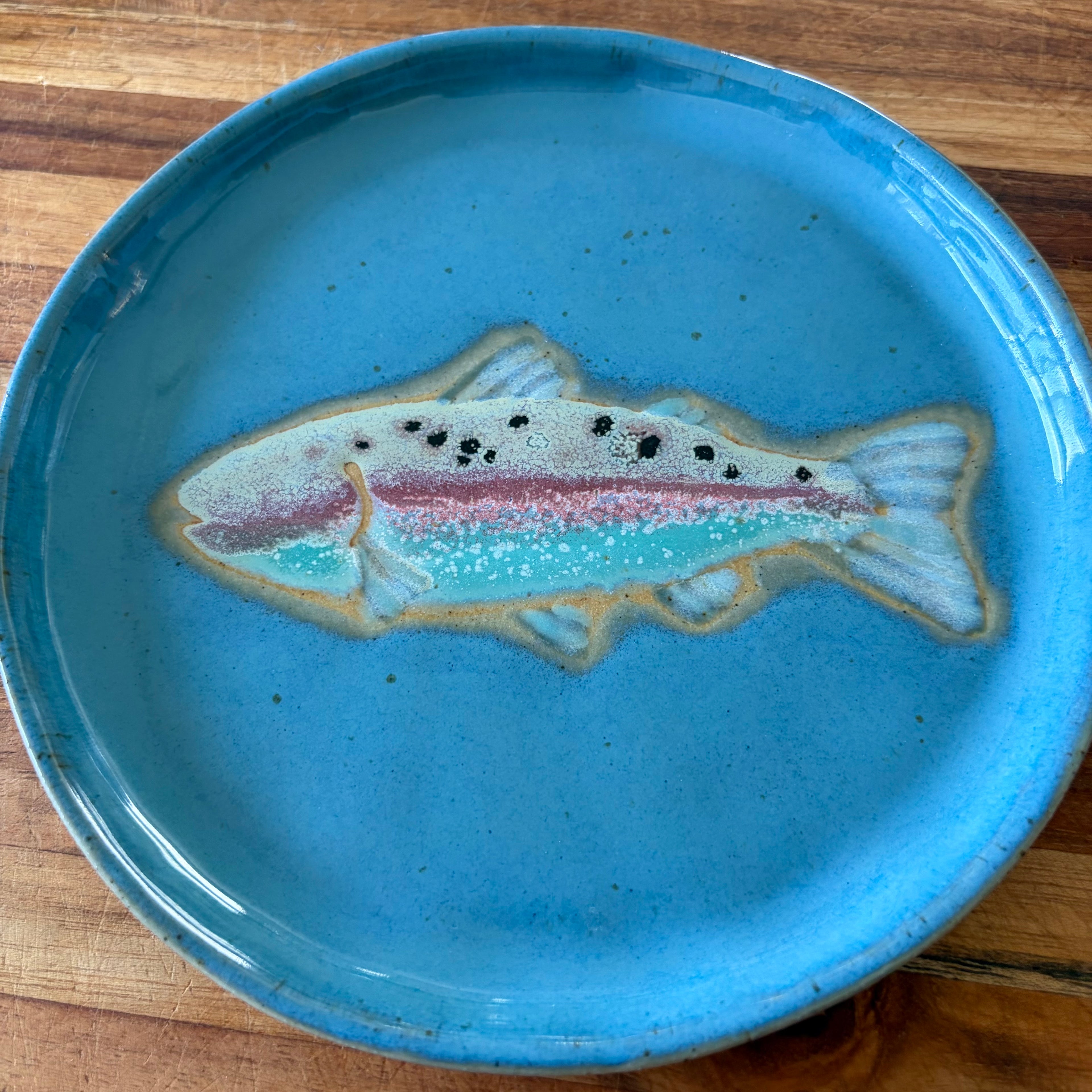 Blue ceramic plate with a rainbow trout